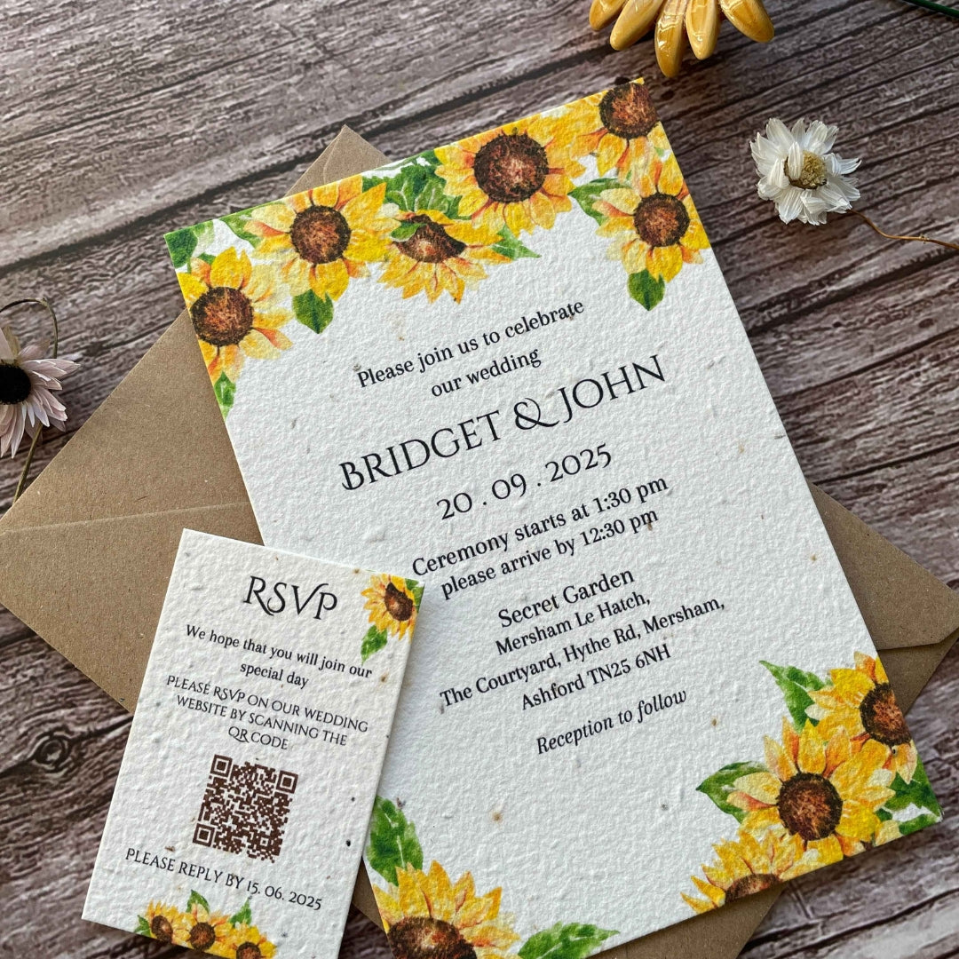 personalised plantable wedding invitations in sunflowers theme, angle view with eco-friendly brown kraft envelope, qr code rsvp on wooden background.
