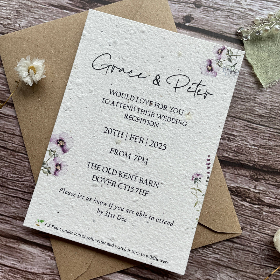 wedding reception invites made of seed paper on a wooden surface