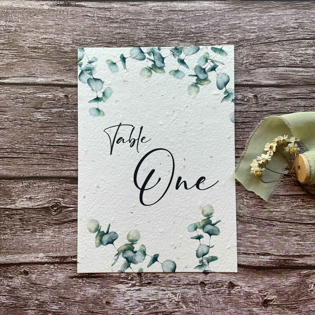 wedding table number or name cards with eucalyptus theme, front close-up view, eco-friendly wedding stationery, alakartcreations