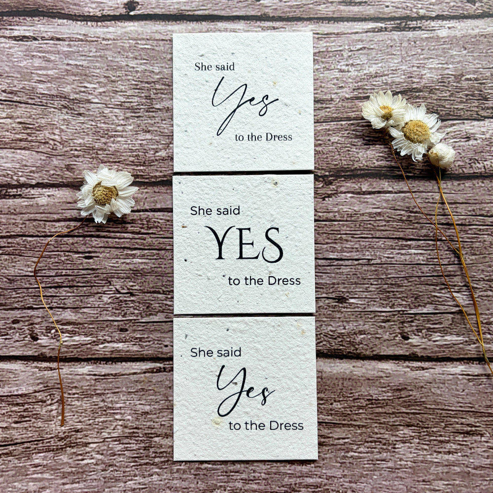 she said yes to the dress card collection on a wooden surface made of seed paper