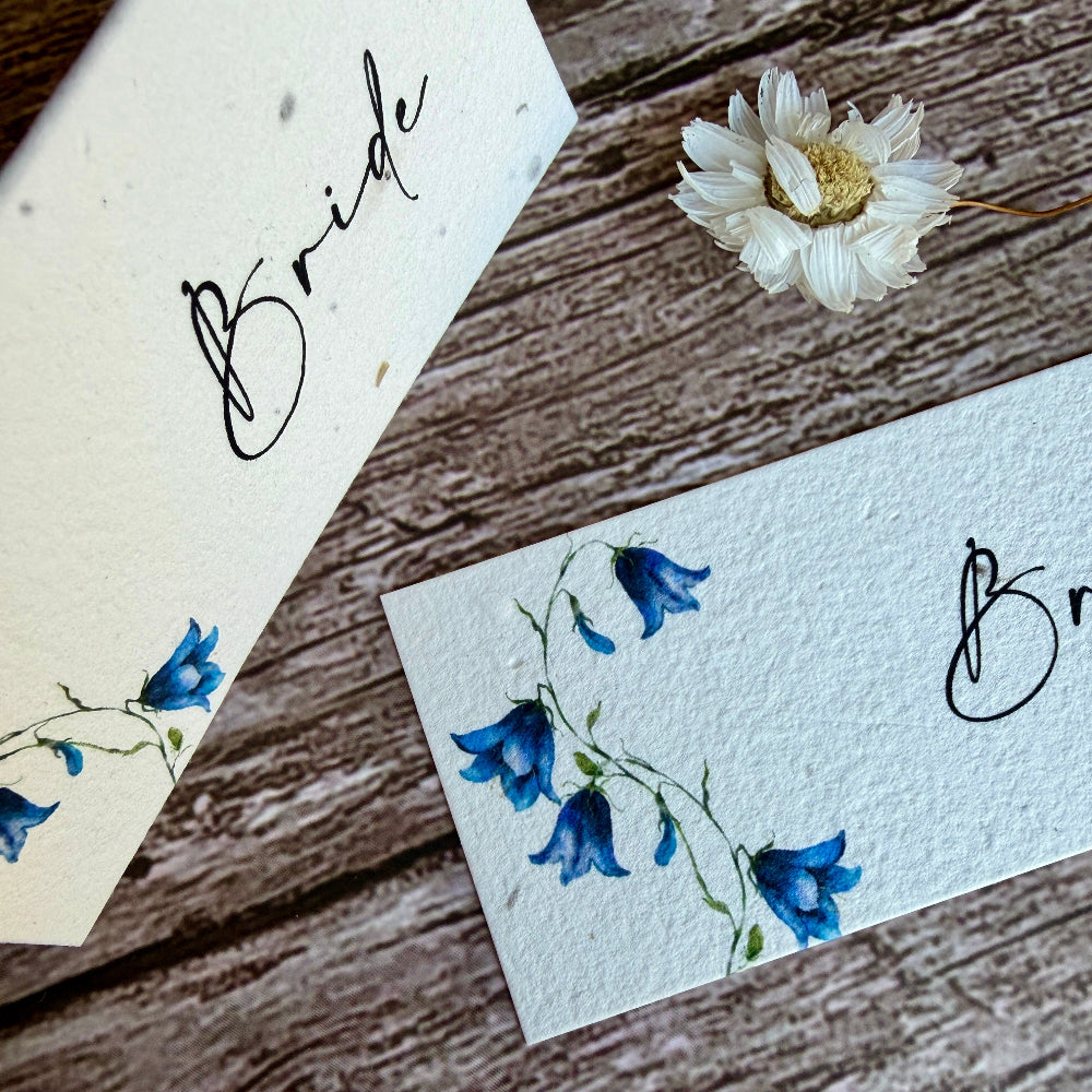 Two plantable weeding place cards with bluebells designs and &
