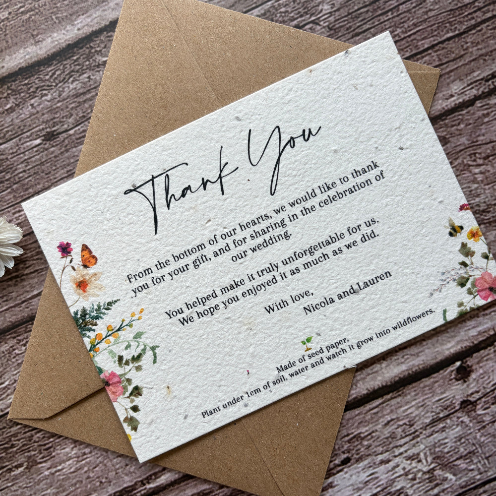 plantable wedding thank you card with wildflowers on a wooden background