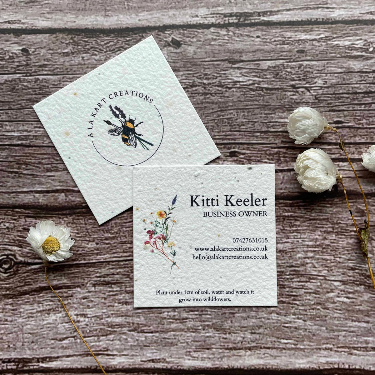 square plantable seed paper business cards with floral design featuring vibrant wildflowers, alakartcreations