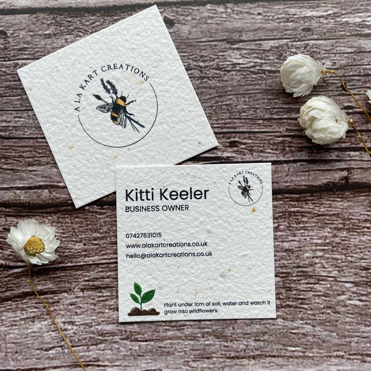 square plantable seed paper business cards with seedling design on front and back, alakartcreations
