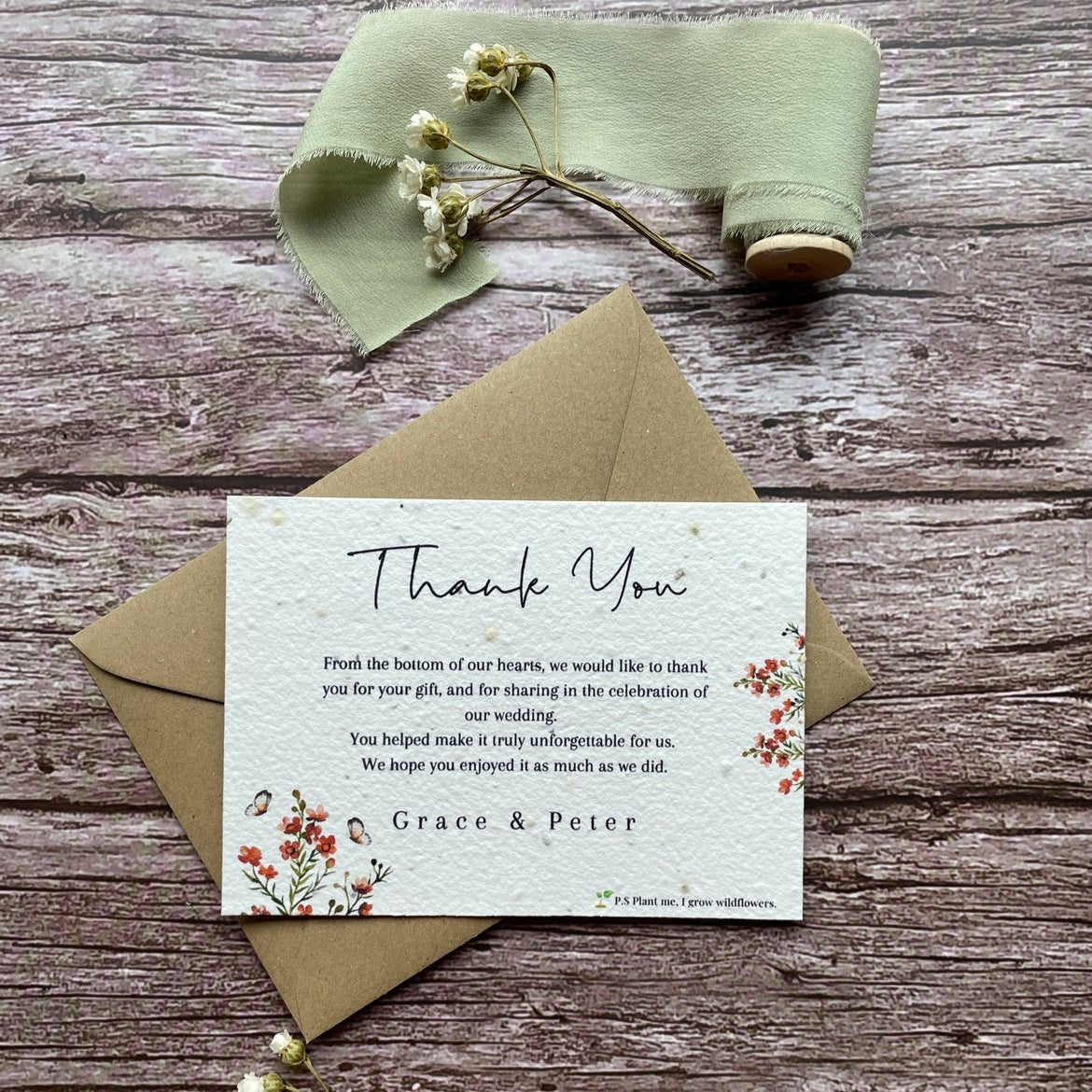 plantable seed paper wedding thank you cards burnt orange theme, front view with eco-friendly brown kraft envelope, floral design on wooden background, alakartcreations