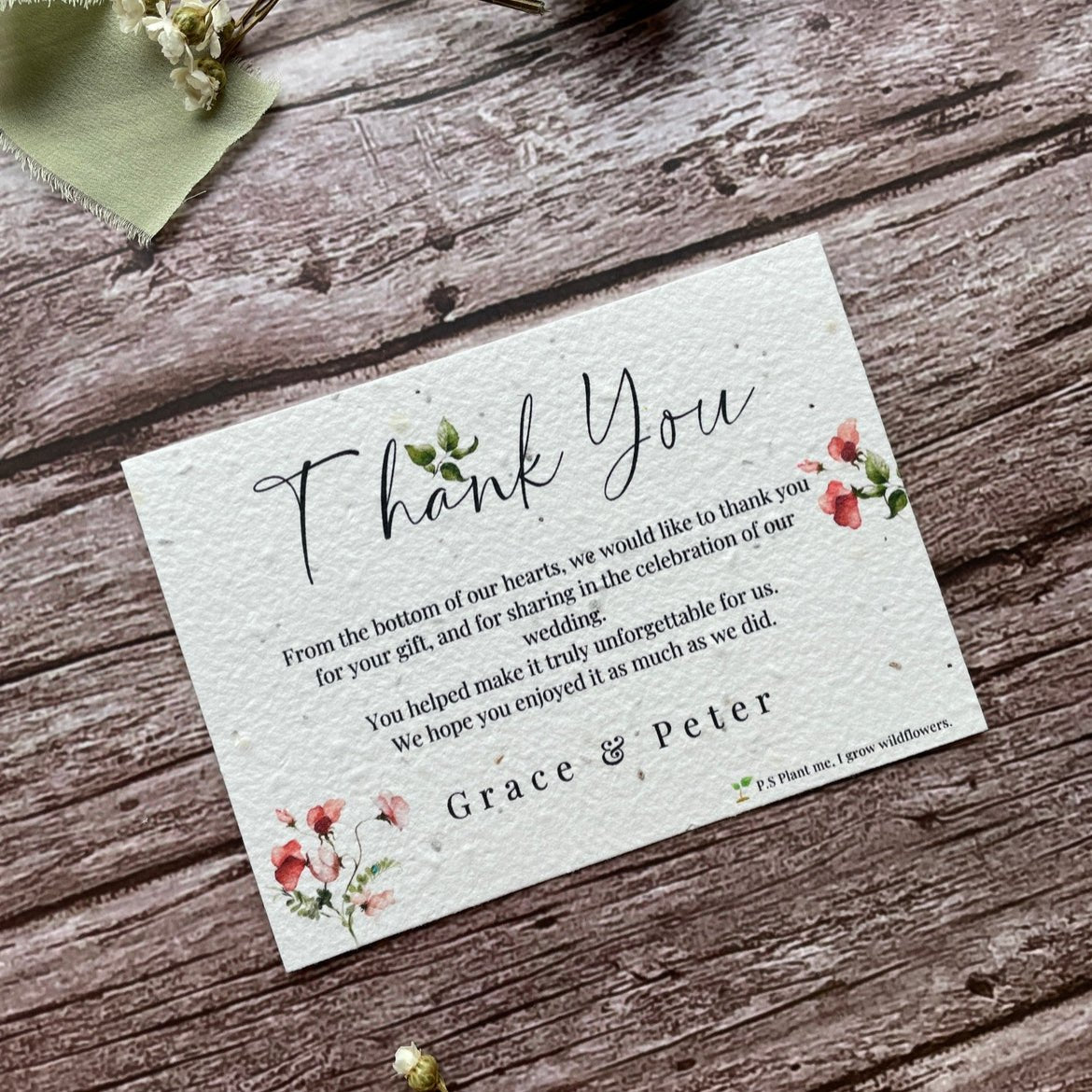 plantable seed paper wedding thank you cards in sweet pea theme, front view with floral design on wooden background