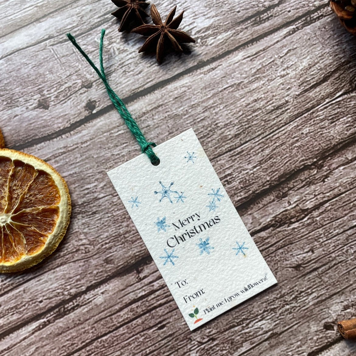 plantable snowflake gift tag on wooden surace