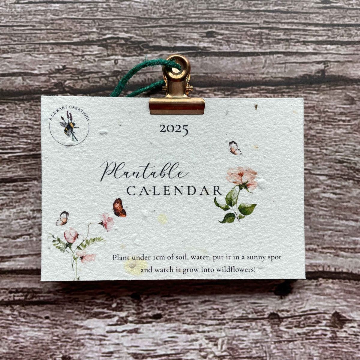 2025 plantable seed paper calendar titled "Secret Garden," showcasing eco-friendly design and vibrant seed paper materials that promote sustainability and blooming wildflowers, alakartcreations