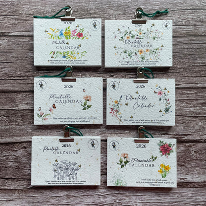 range of plantable calendars on wooden background with floral designs