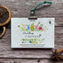 Floral design 2026 plantable calendar on a wooden surface with decorative elements