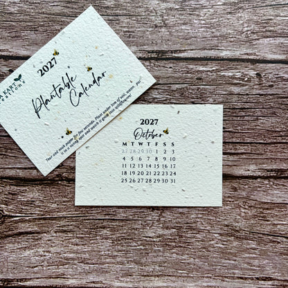 Two square paper calendar cards for 2027, one showing the cover with the title &