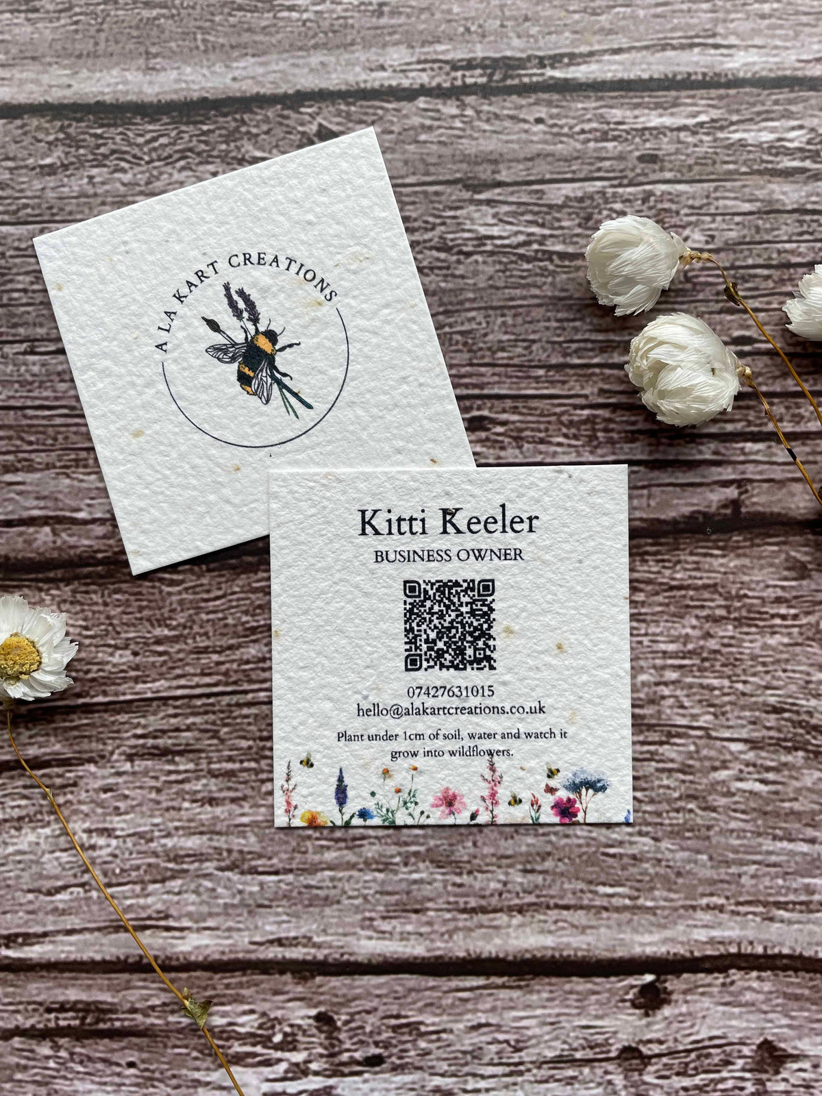 seed paper plantable business cards in a square shape with a QR code