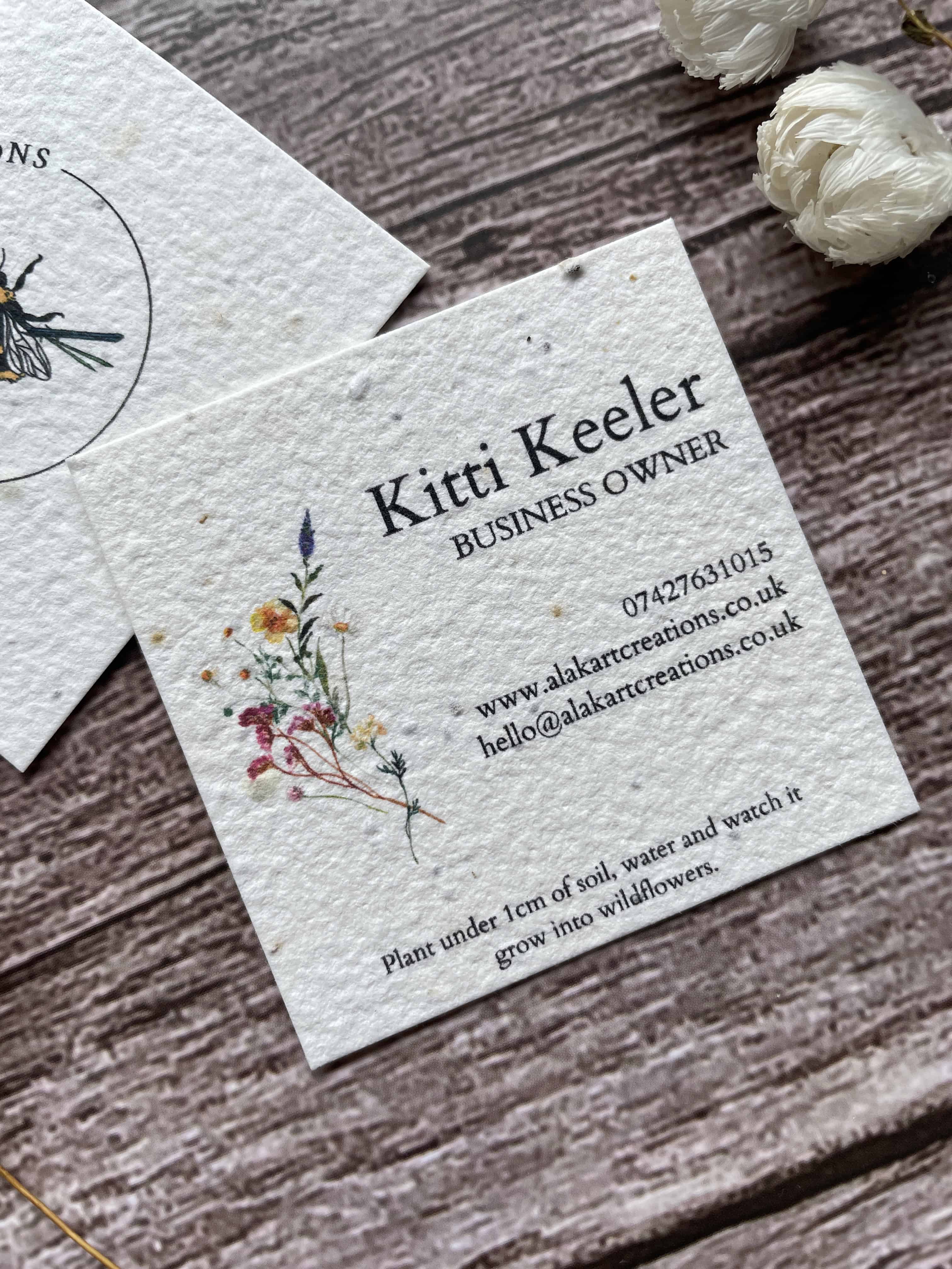Plantable Seed Paper Business Cards with a wildflower design close up.
