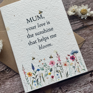 angled view of personalised plantable mother's day card with wildflowers and bees, message "mum your love is the sunshine that helps me bloom" - alakartcreations