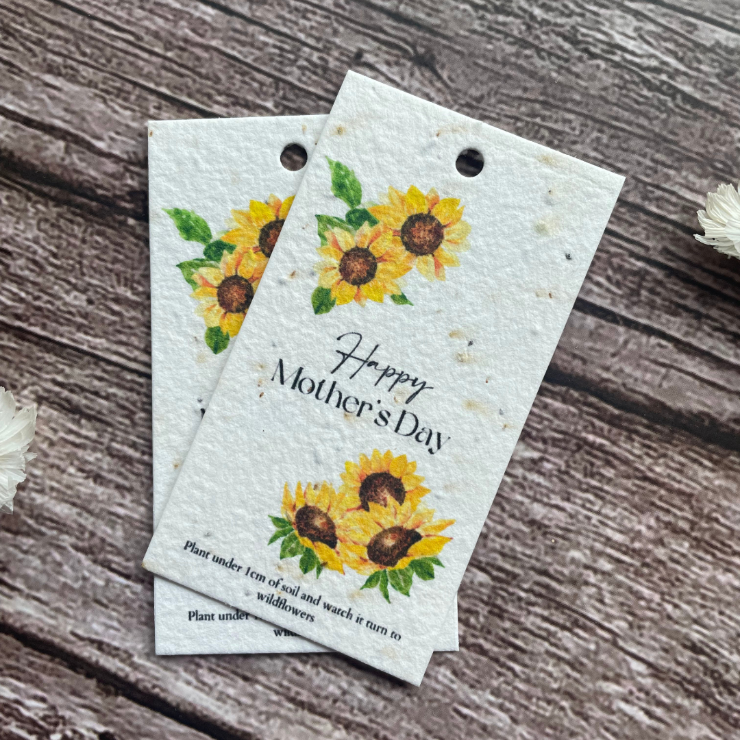 angled view of plantable sunflower gift tags featuring delicate flower illustrations, made from uk wildflower seed paper, available at a la kart creations