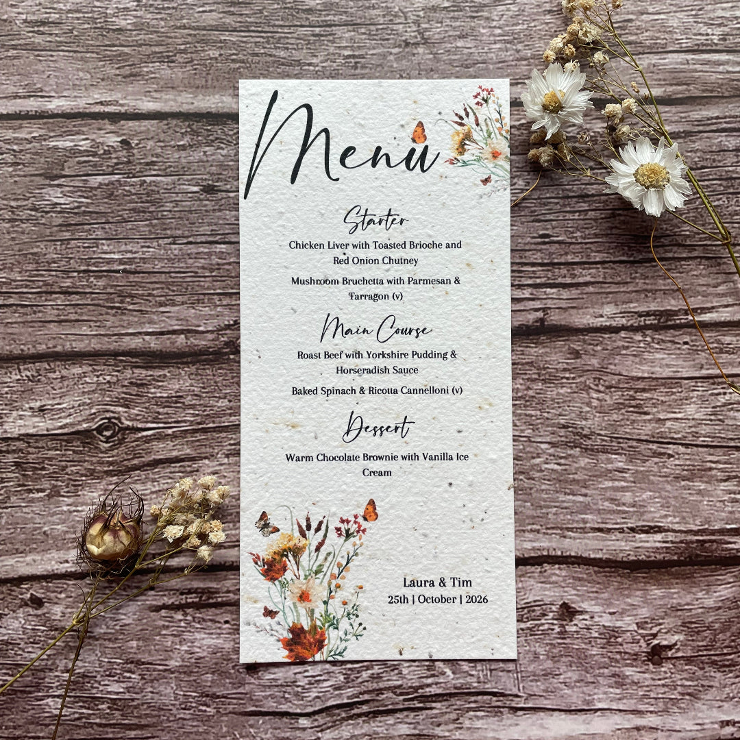 Autumn floral themed Menu card made from seed paper on a wooden surface