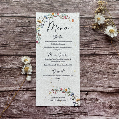 Seed Paper Floral menu card on a wooden surface with dried flowers