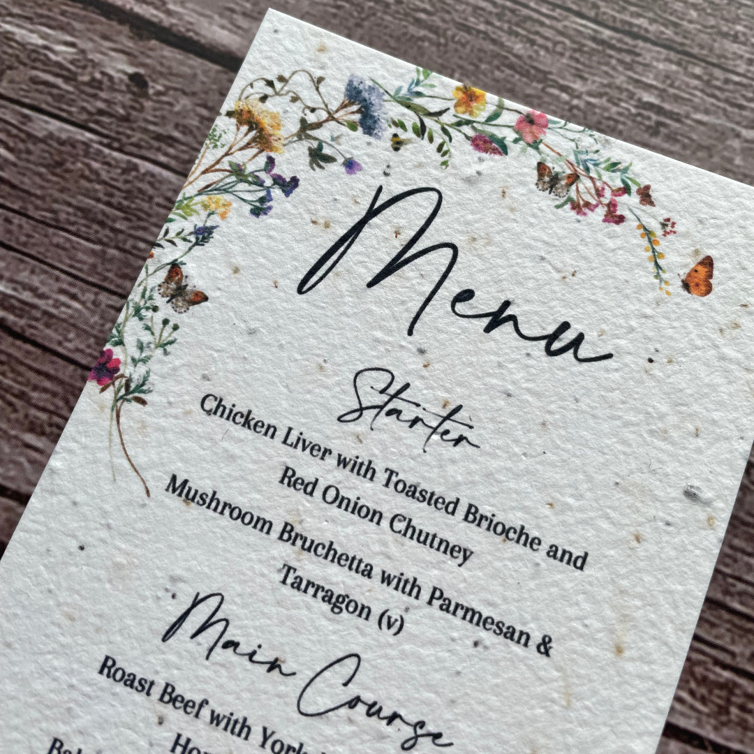 plantable Menu card with floral design on a wooden surface