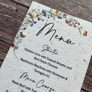 plantable Menu card with floral design on a wooden surface