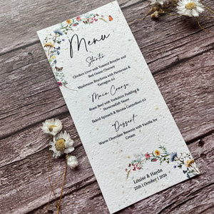 Seed paper Menu card with floral designs on a wooden surface
