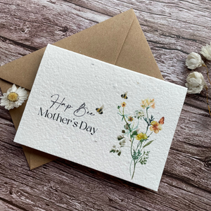 angled view personalised plantable mother's day card with buzzing bees and wildflowers, feat. "Hap-Bee Mother's Day" message