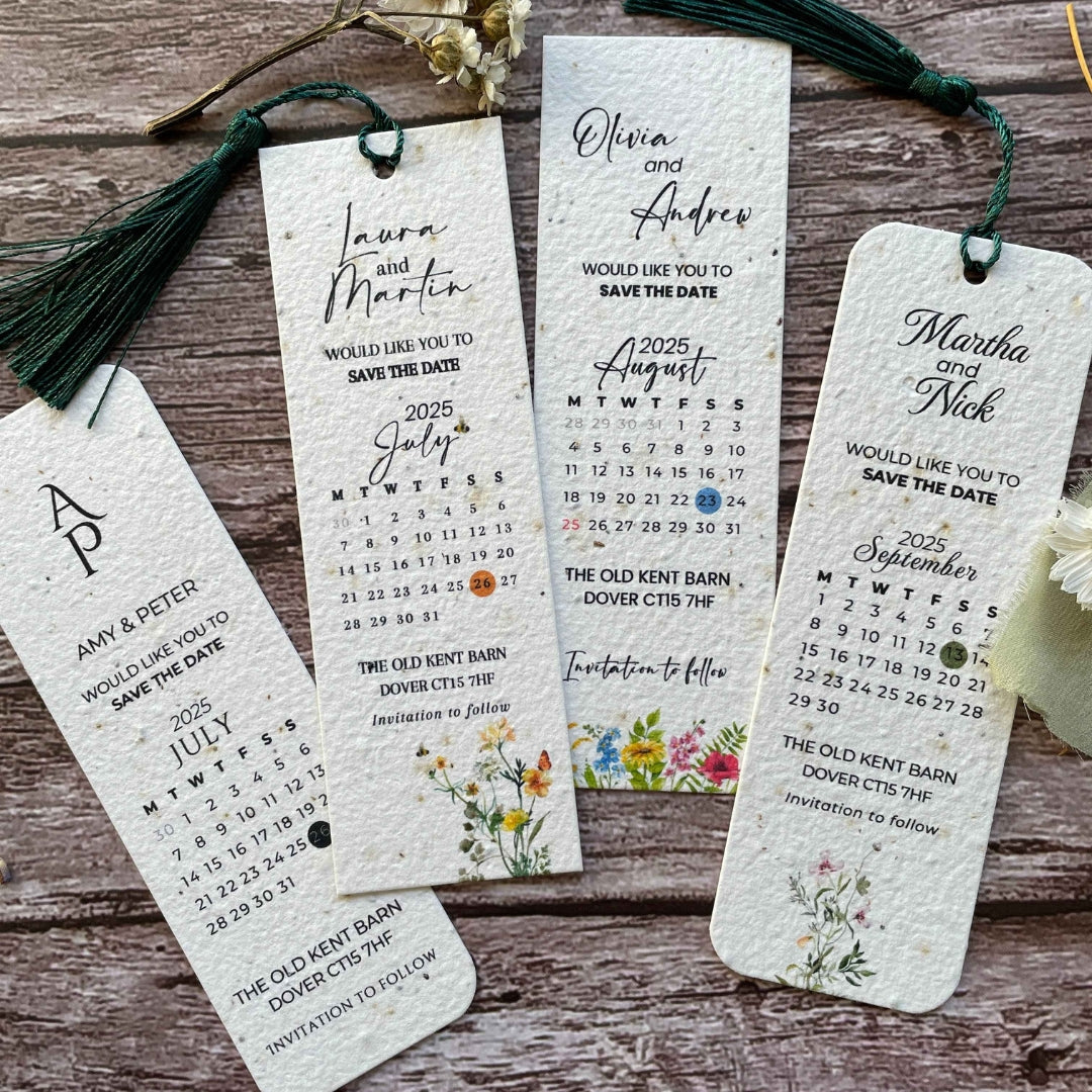 close-up front view of personalised plantable wedding save the date bookmarks on a wooden background, highlighting seed paper and tassel details.