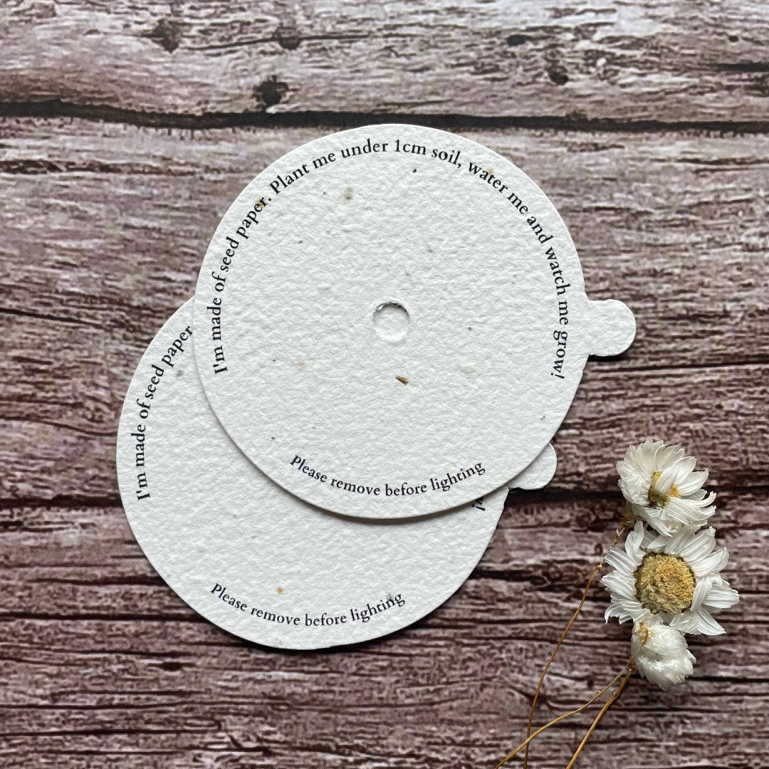 Two round paper seed paper candle dust covers