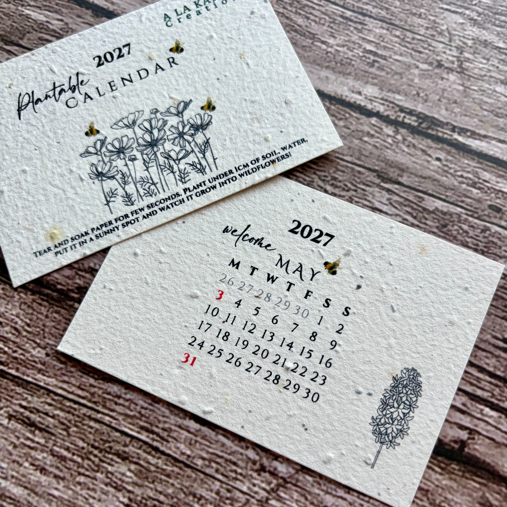 plantable calendar may month 2027 on a wooden background