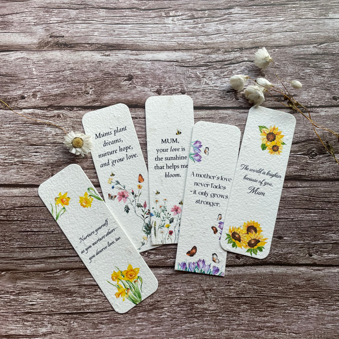 collection of mother's day plantable bookmarks on a wooden surface