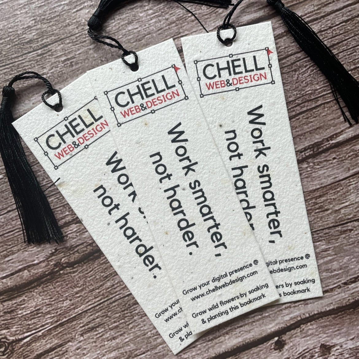 plantable seed paper bookmarks for client on boarding gifts on a wooden board with tassel