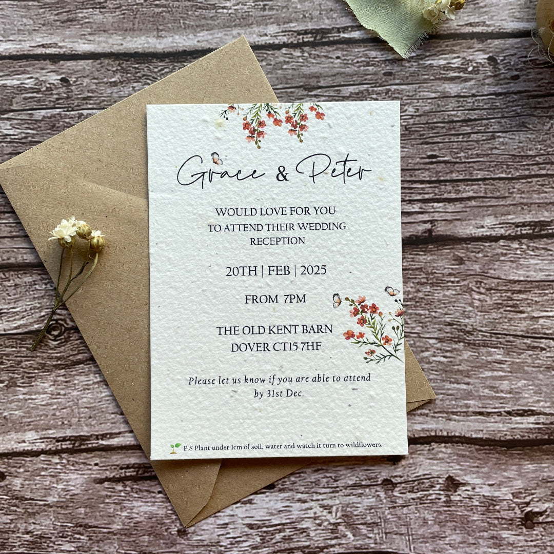 seed paper evening wedding reception invites on a wooden surface