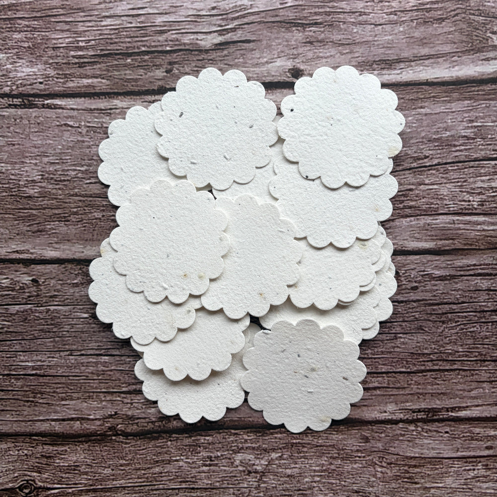 plantable seed paper flower shaped tags on a wooden background