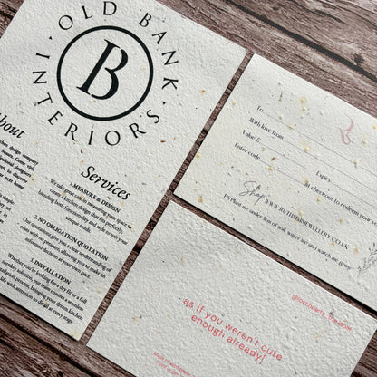 plantable flyers and postcards on a wooden surface