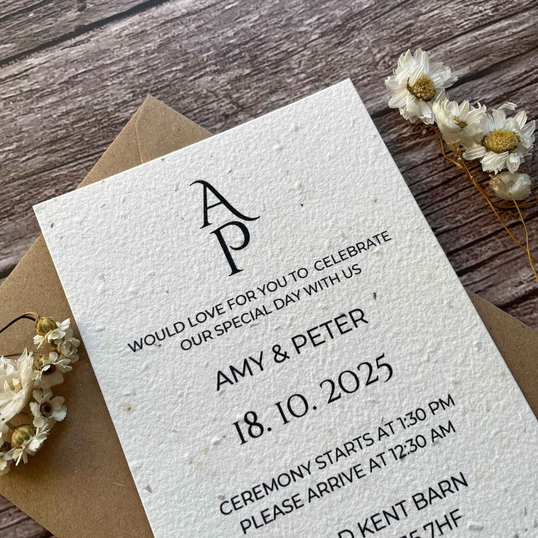 plantable seed paper wedding invites on a wooden surface