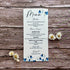 Plantable menu card with bluebells design on a wooden surface