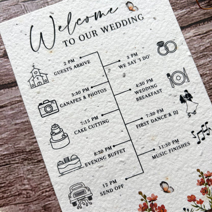Wedding order of the day card made of plantable paper on a wooden surface