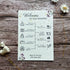 seed paper wedding order of service with lilac flowers on wooden surface
