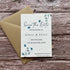Wedding save the date invitation card with envelope on a wooden surface printed on seed paper