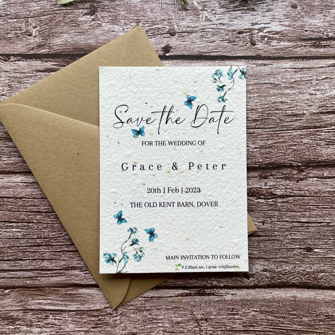 Wedding save the date invitation card with envelope on a wooden surface printed on seed paper