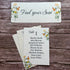 Plantable yellow meadow seating arrangement cards with floral designs on a wooden surface