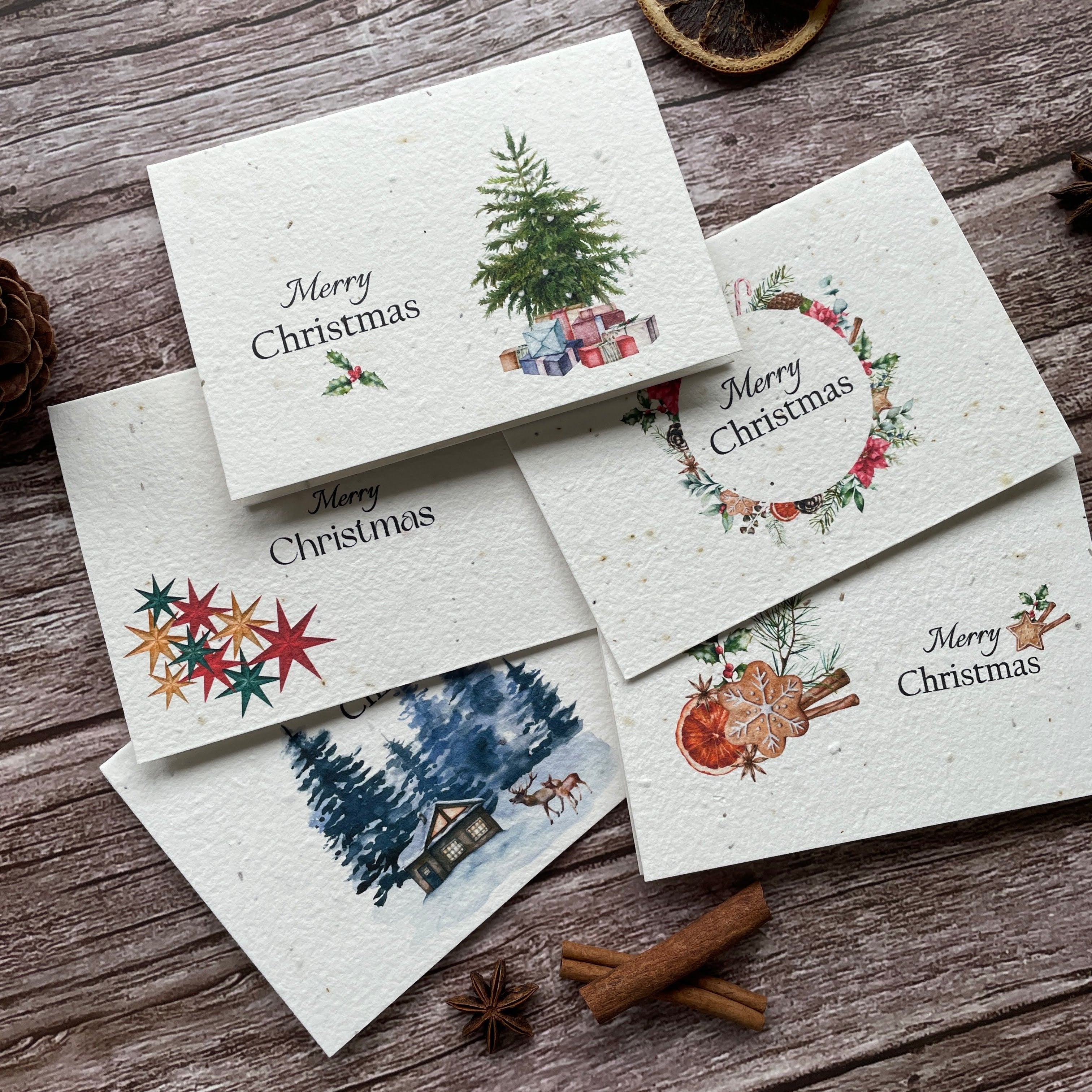 plantable seed paper Christmas cards with pine forest, gingerbread, stars, tree and wreath design