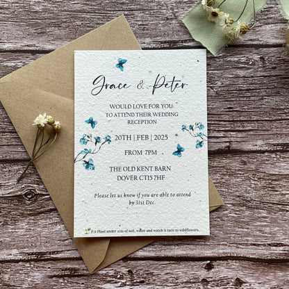 plantable evening wedding invites on a wooden surface