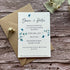 plantable evening wedding invites on a wooden surface