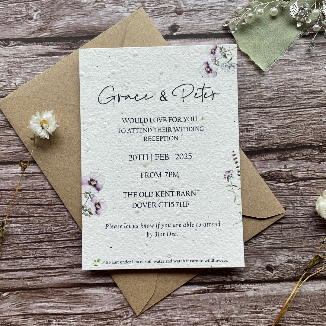 evening reception wedding invites made from seed paper on a wooden surface