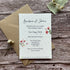Wedding reception invitation card with floral design on a wooden surface