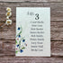 plantable wedding seating plan with lovers and bluebells design on a wooden background