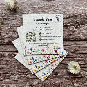plantable seed paper thank you cards on wooden background