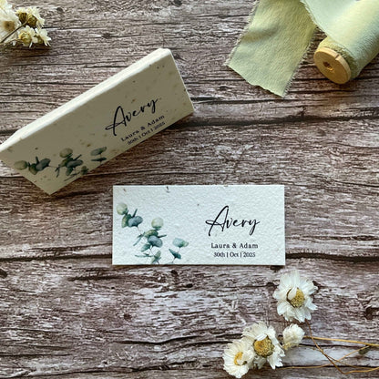 A flat eucalyptus-themed place card made from seed paper stationery