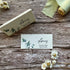 A flat eucalyptus-themed place card made from seed paper stationery