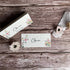 Floral seed paper wedding place cards with &